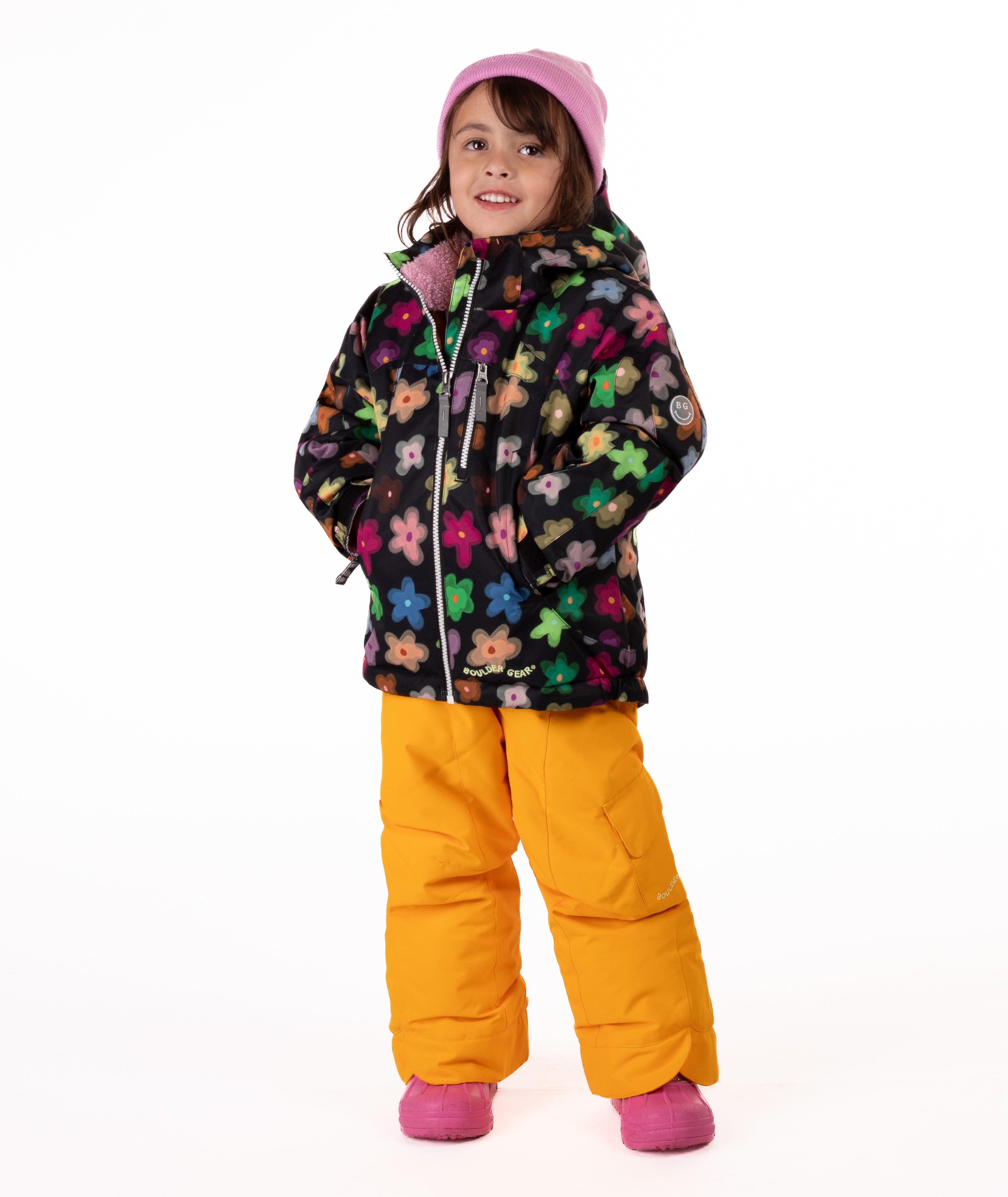 Child wearing a colorful floral patterned jacket on a white background