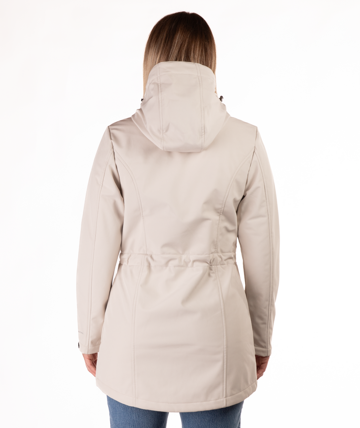 back of beige parka worn by a person on a white background