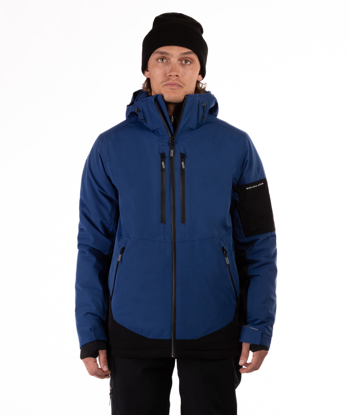 Person wearing a blue jacket with black accents on a white background