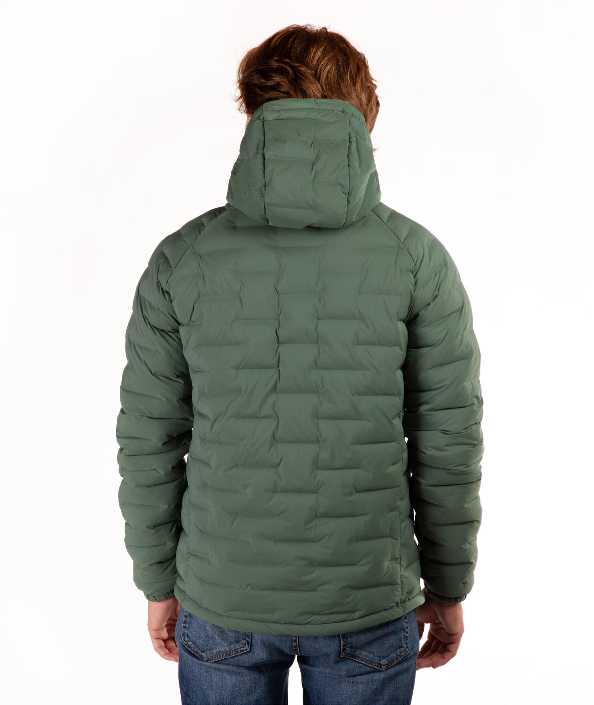 A person viewed from the back wearing a quilted hooded puffer jacket in green, paired with blue jeans, against a plain white studio background.