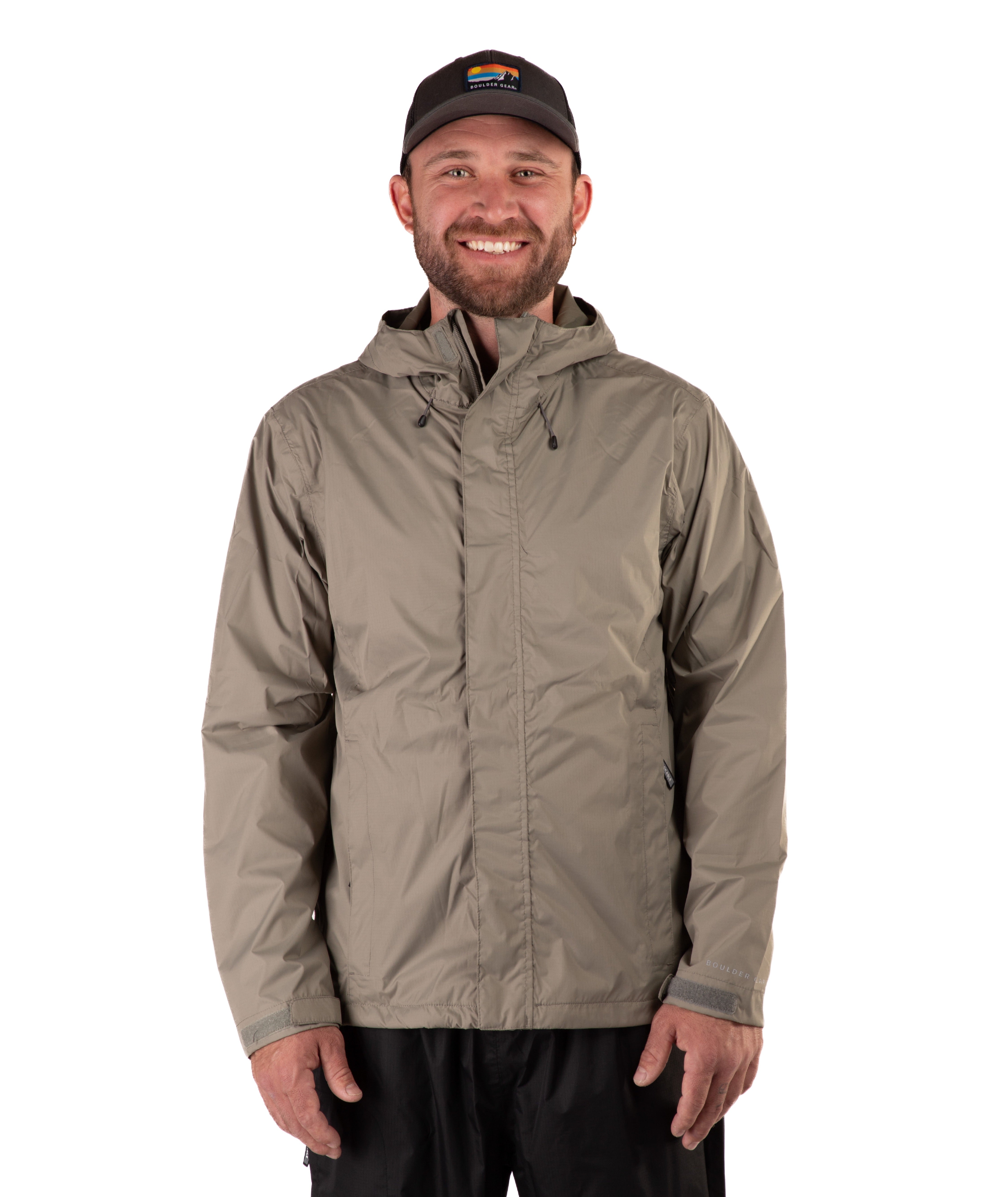 Man wearing a beige raincoat and black cap on a white background