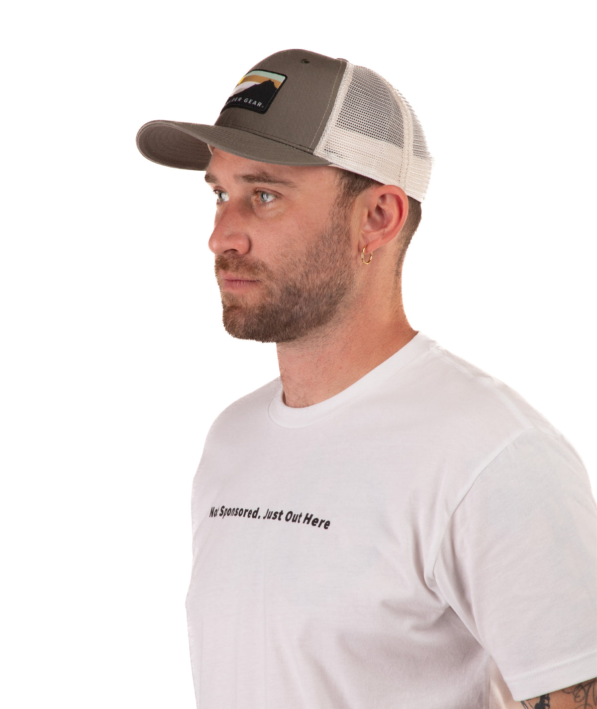 Man wearing a green cap and white t-shirt with text on a white background