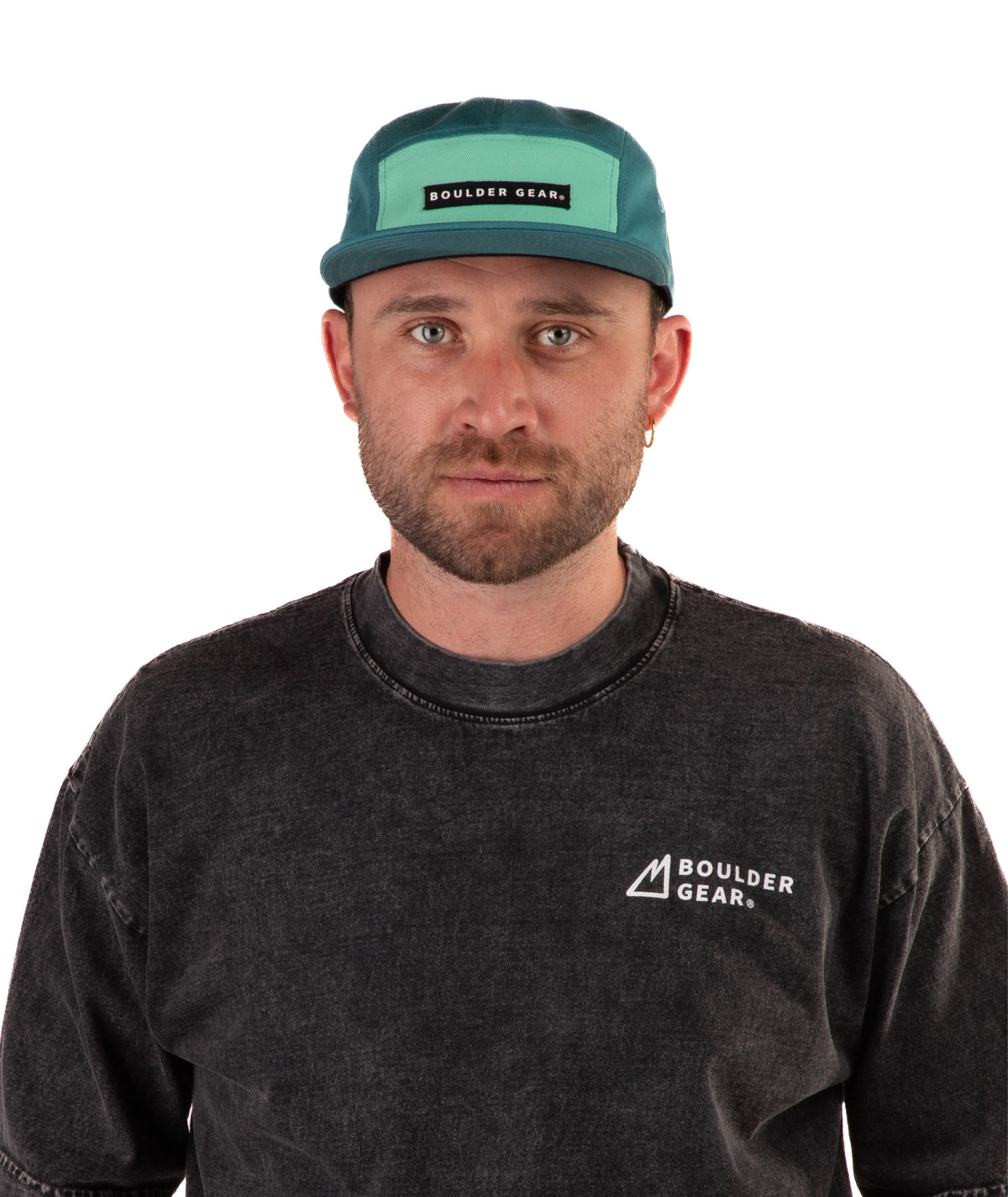 Man wearing a black T-shirt and green cap with 'Boulder Gear' logo on a white background
