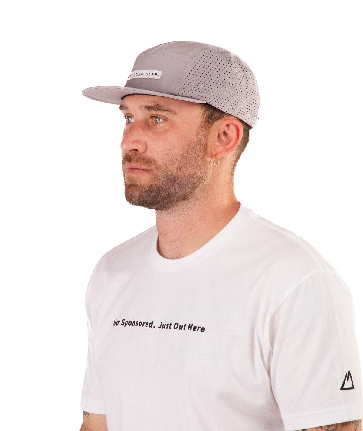 Man wearing a white t-shirt with text and a gray cap on a white background
