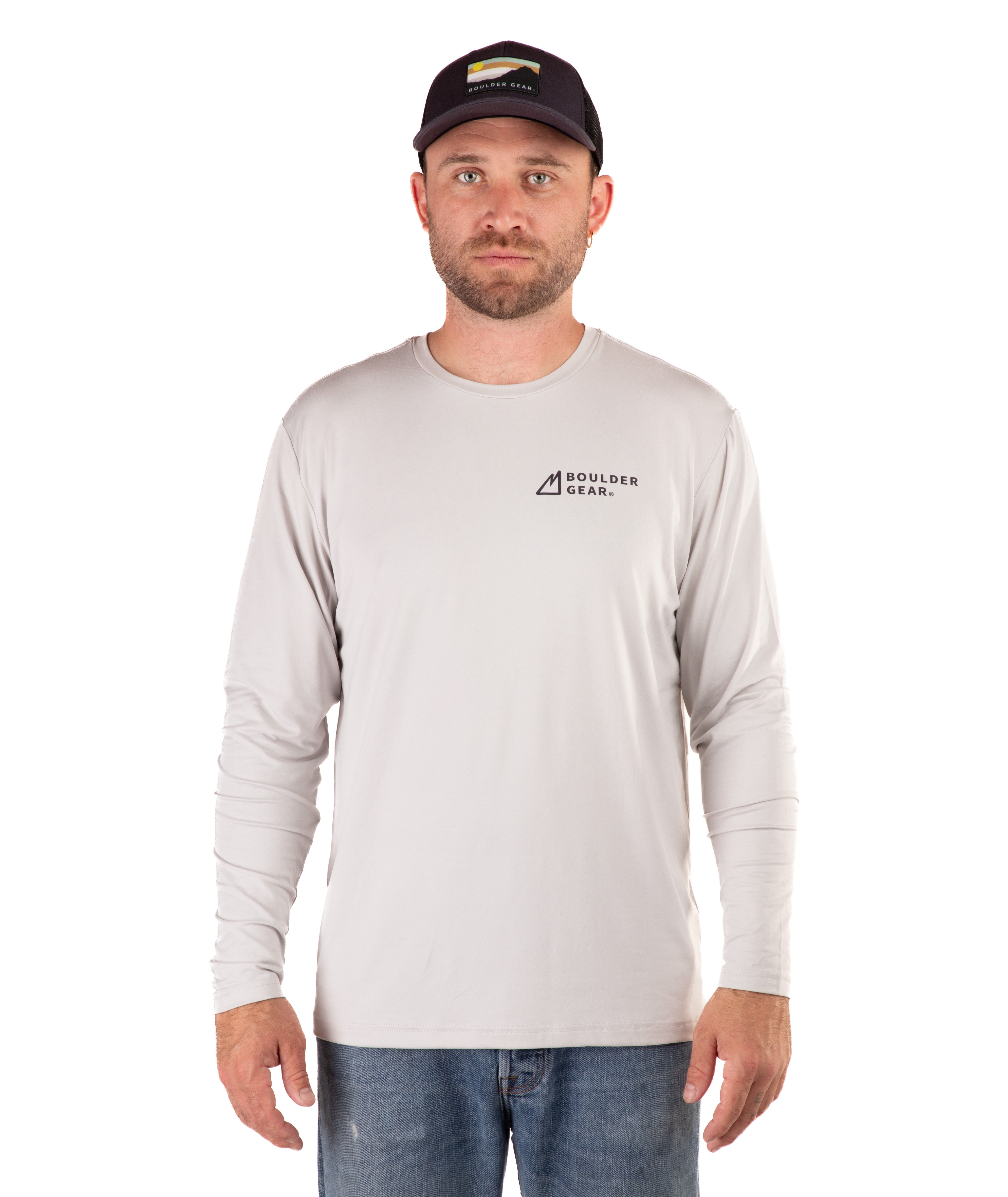 Man wearing a light gray long-sleeve shirt with a logo on a white background
