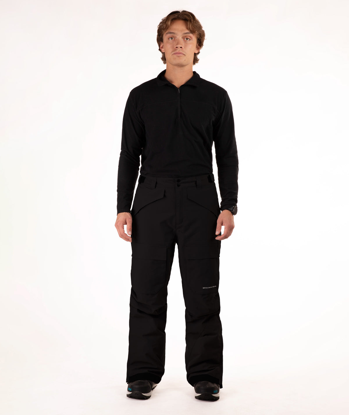 Person wearing a black outfit on a white background