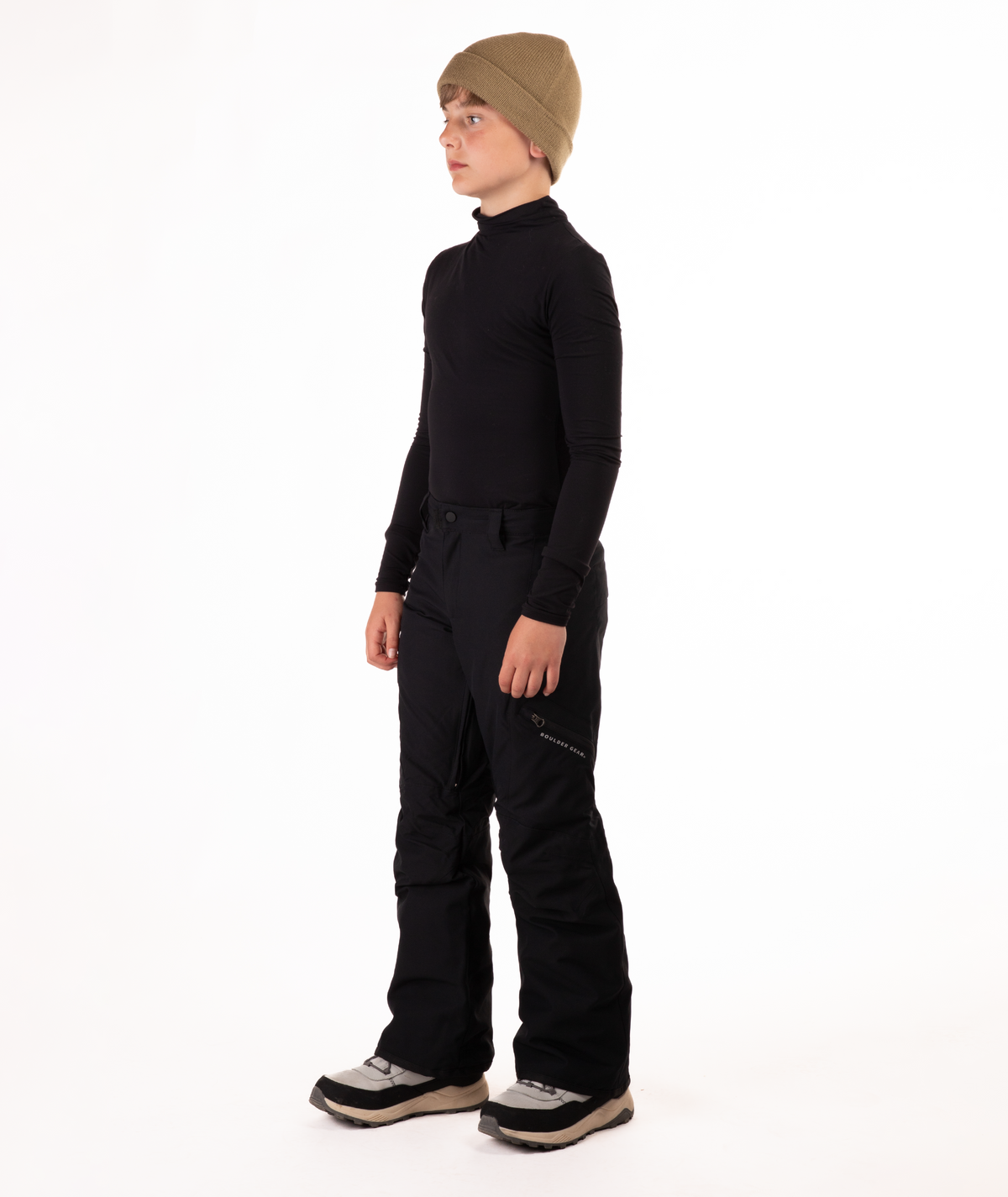 youth boy wearing a black long-sleeve shirt and black snow pants on a white background