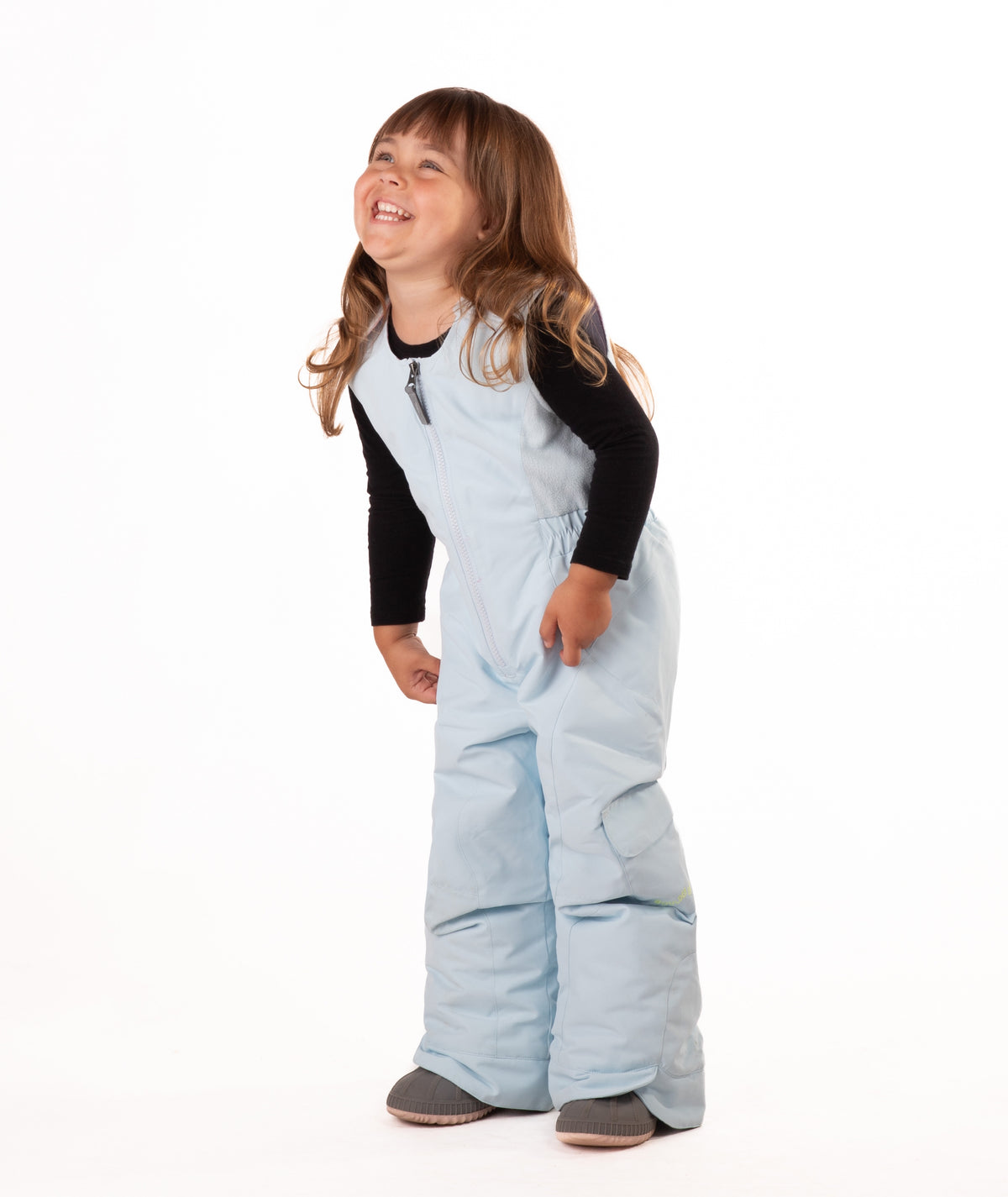 child wearing a light blue snow bib with black top on a white background