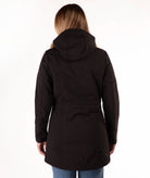 Person wearing a black hooded jacket on a white background
