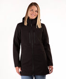 Woman wearing a black coat on a white background