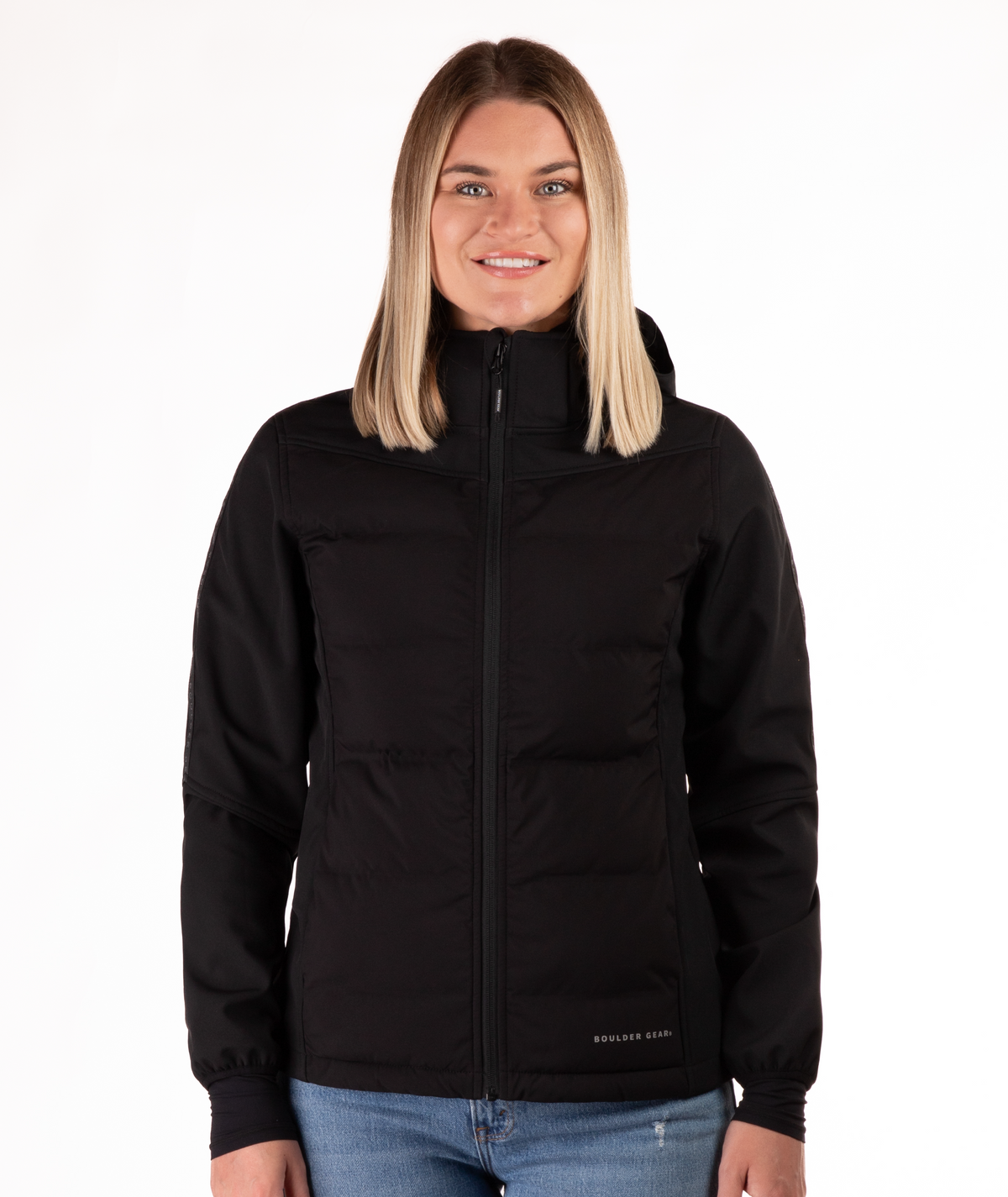 Woman wearing a black jacket with a visible brand logo on a white background