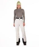 Person wearing off white colored pants on a white background