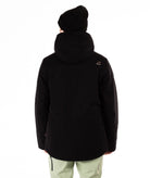 back of Person wearing a black jacket, light green pants and black beanie on a white background