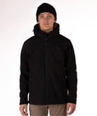 Man wearing a black jacket with a white background