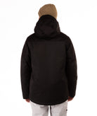 Person wearing a black jacket with a hood from behind on a white background