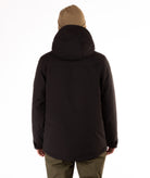 Man wearing a hooded black jacket with a brand logo on a white background