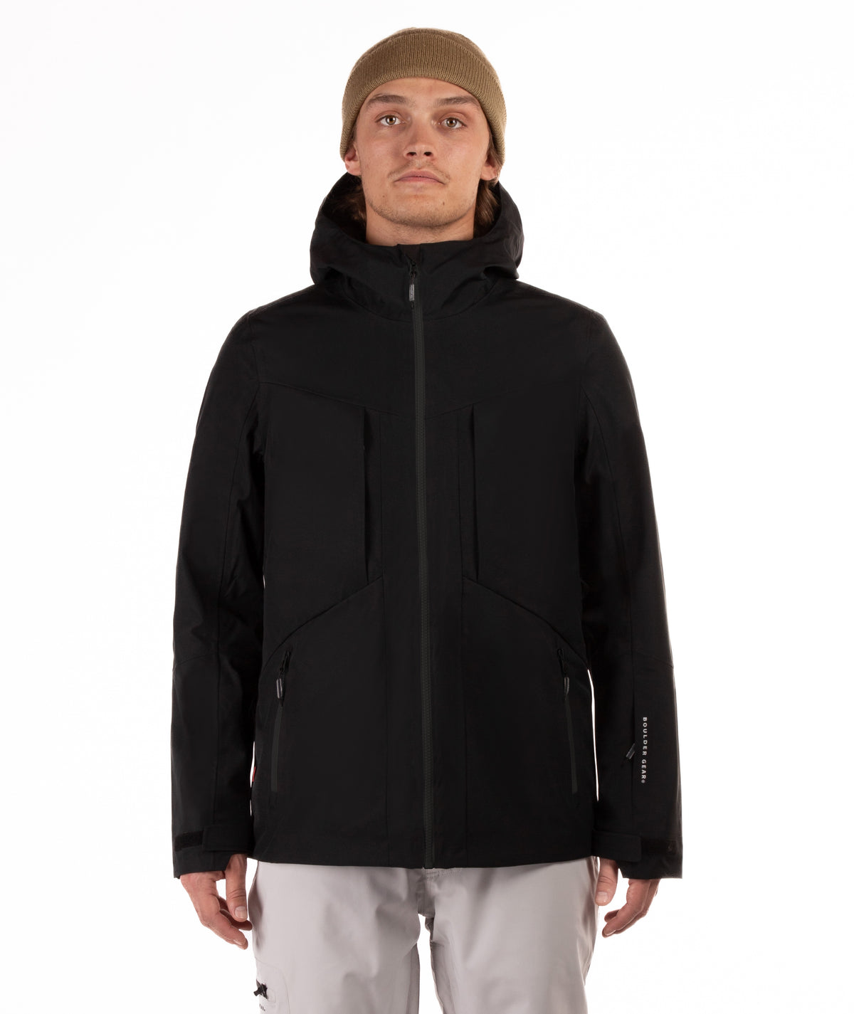 Person wearing a black jacket with black accents on a white background