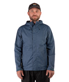Man wearing a blue raincoat and black cap on a white background