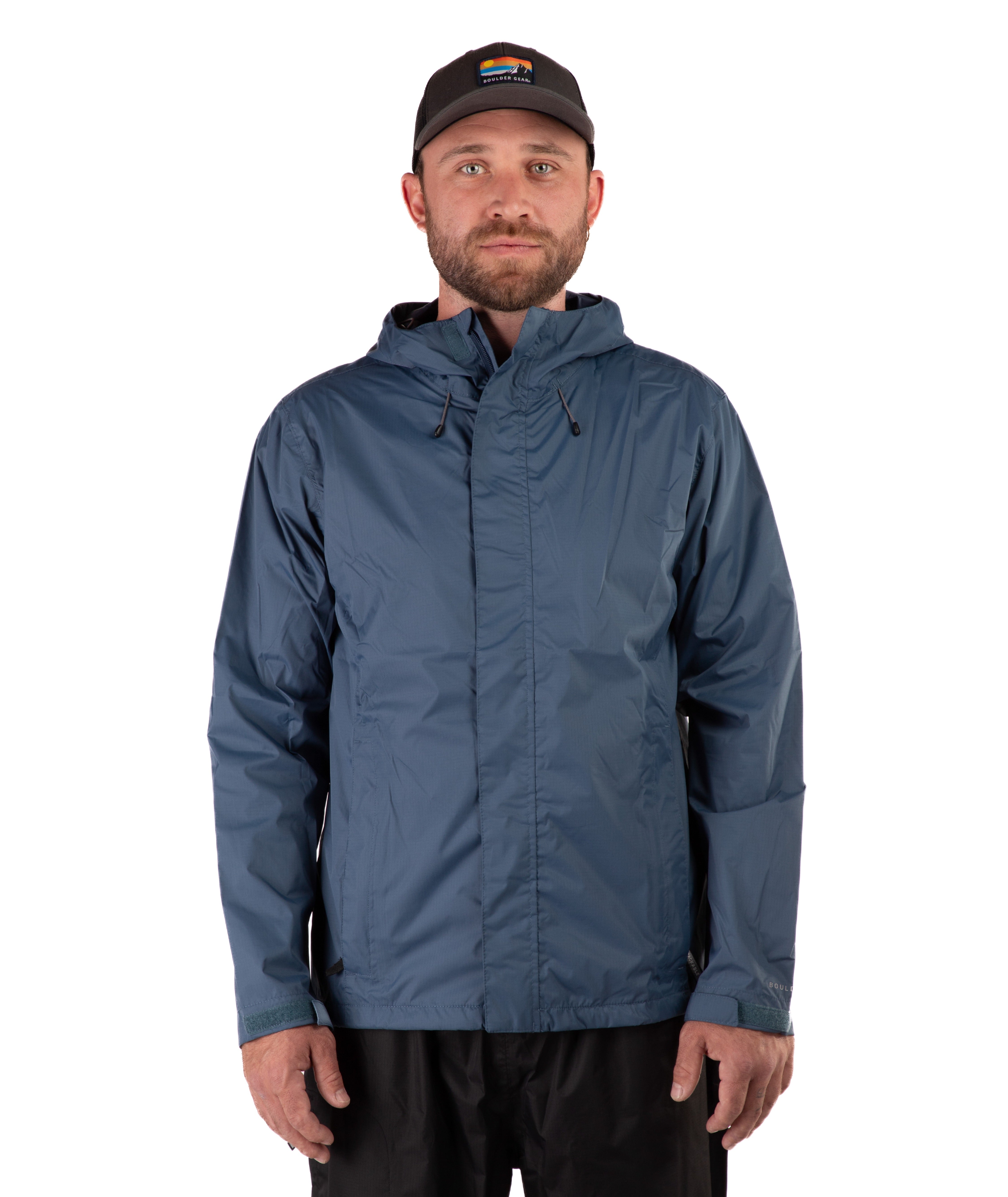 Man wearing a blue raincoat and black cap on a white background