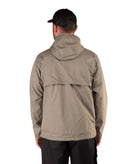 back of a Man wearing a beige raincoat and black cap on a white background
