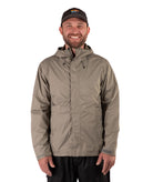 Man wearing a beige raincoat and black cap on a white background