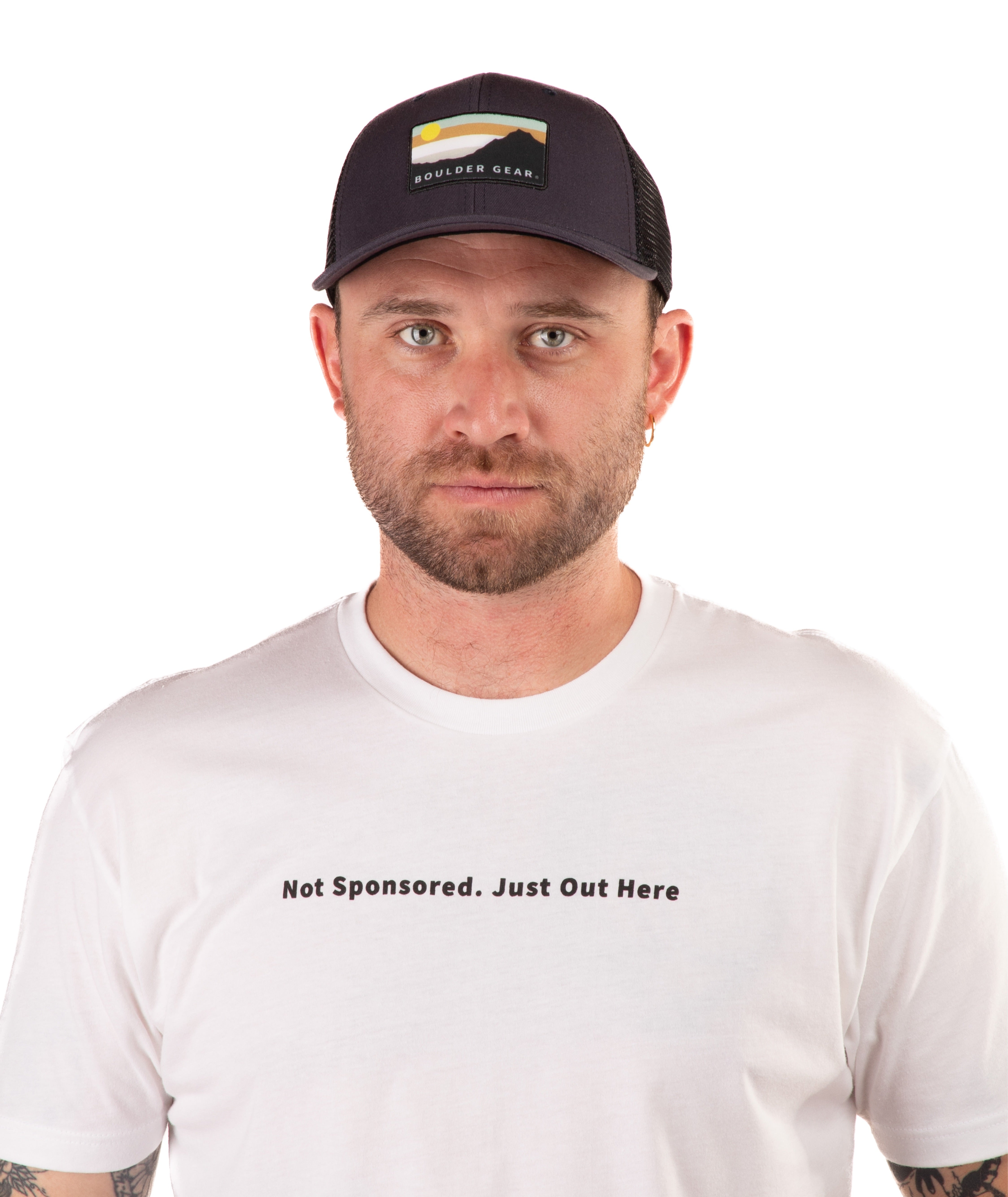Man wearing a navy cap and white t-shirt with text on a white background