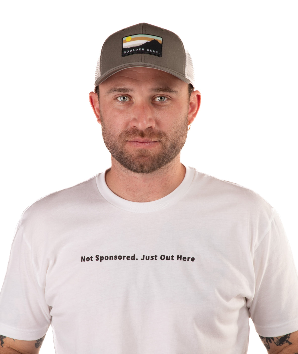 Man wearing a green cap and white t-shirt with text on a white background