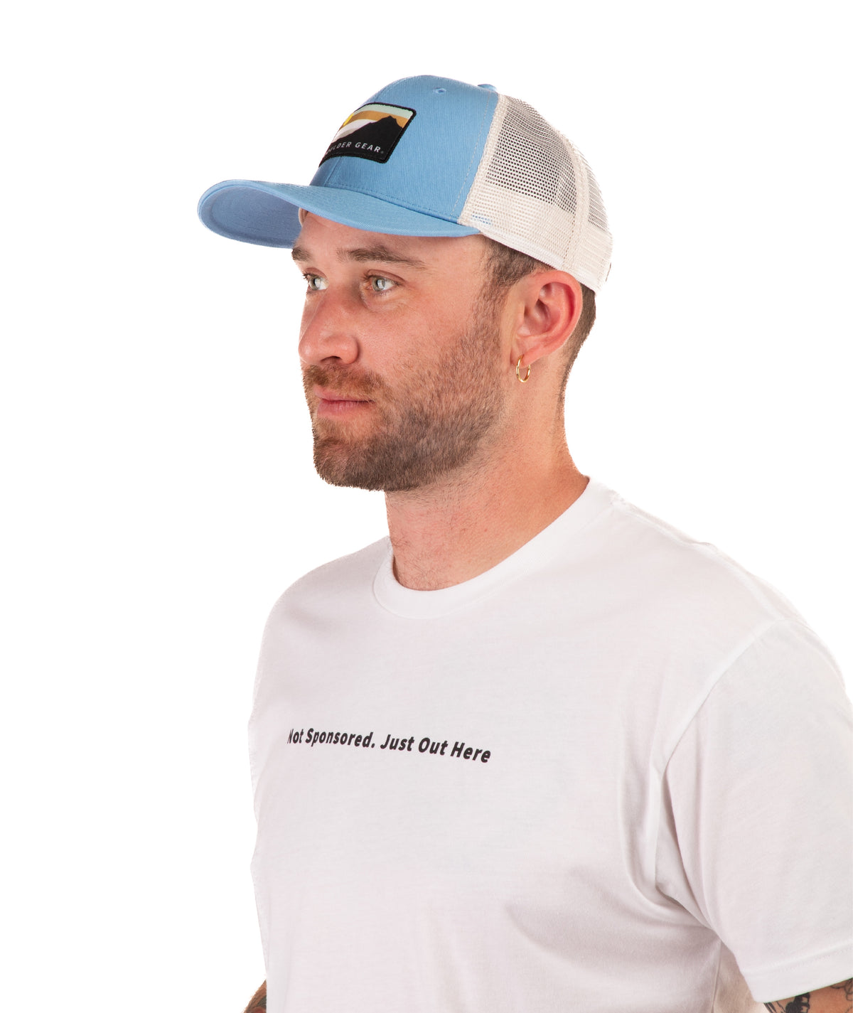 Man wearing a blue cap and white t-shirt with text on a white background