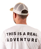 back of a Man wearing a yellow cap and white t-shirt with text on a white background