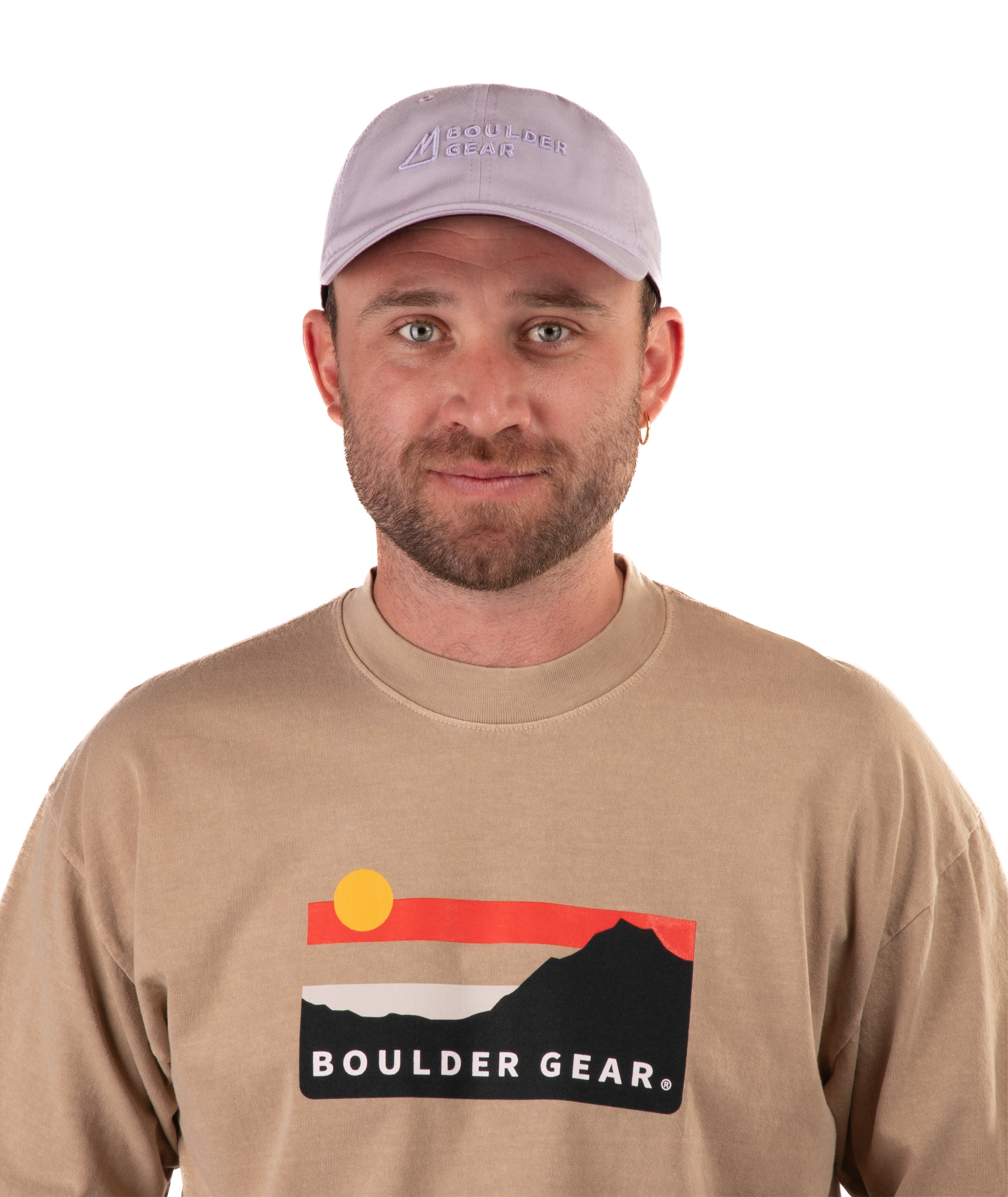 Man wearing a beige long-sleeve shirt with 'Boulder Gear' logo and a light purple cap on a white background