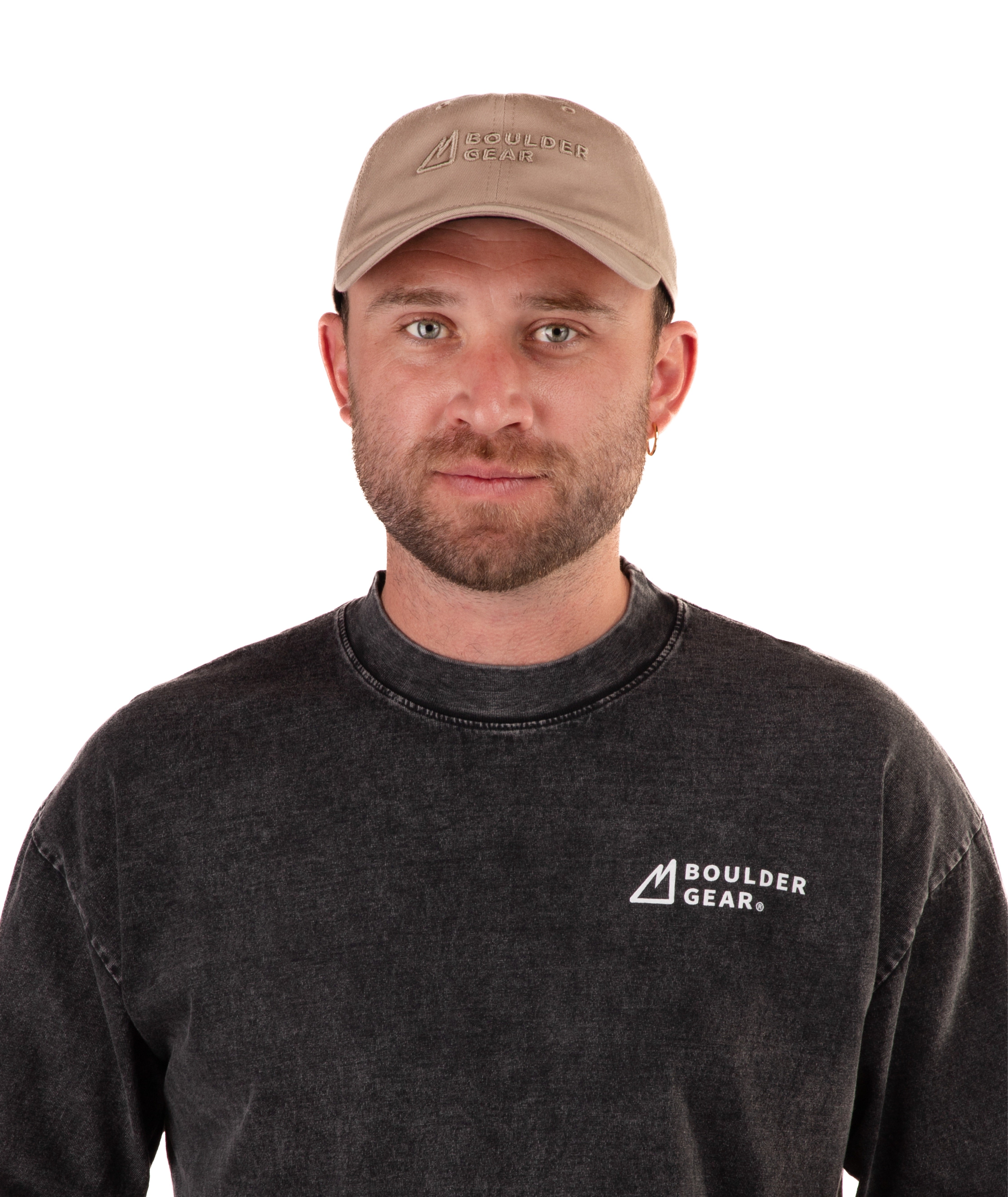 Man wearing a black Boulder Gear T-shirt and khaki cap on a white background