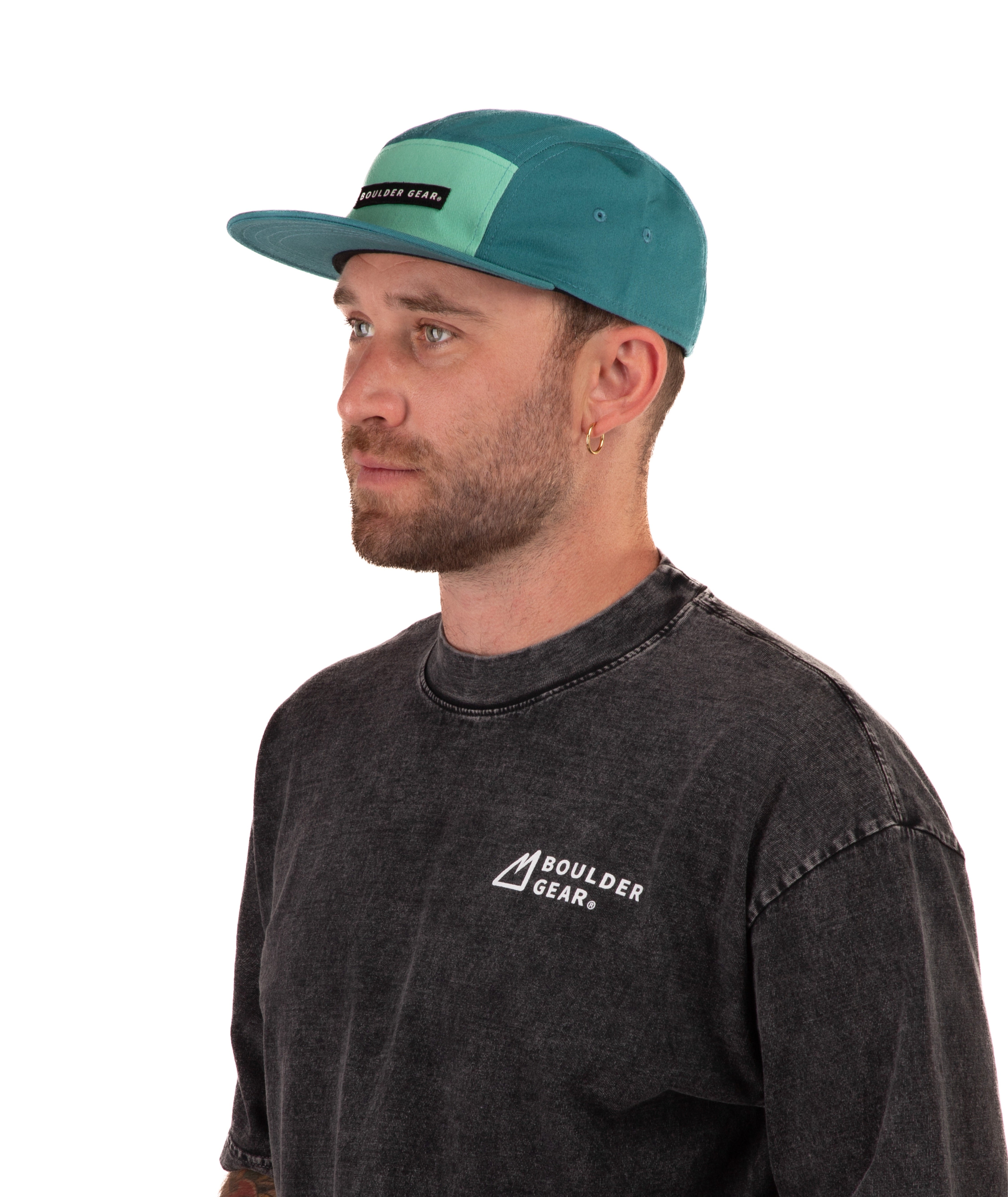 Man wearing a black T-shirt and green cap with 'Boulder Gear' logo on a white background