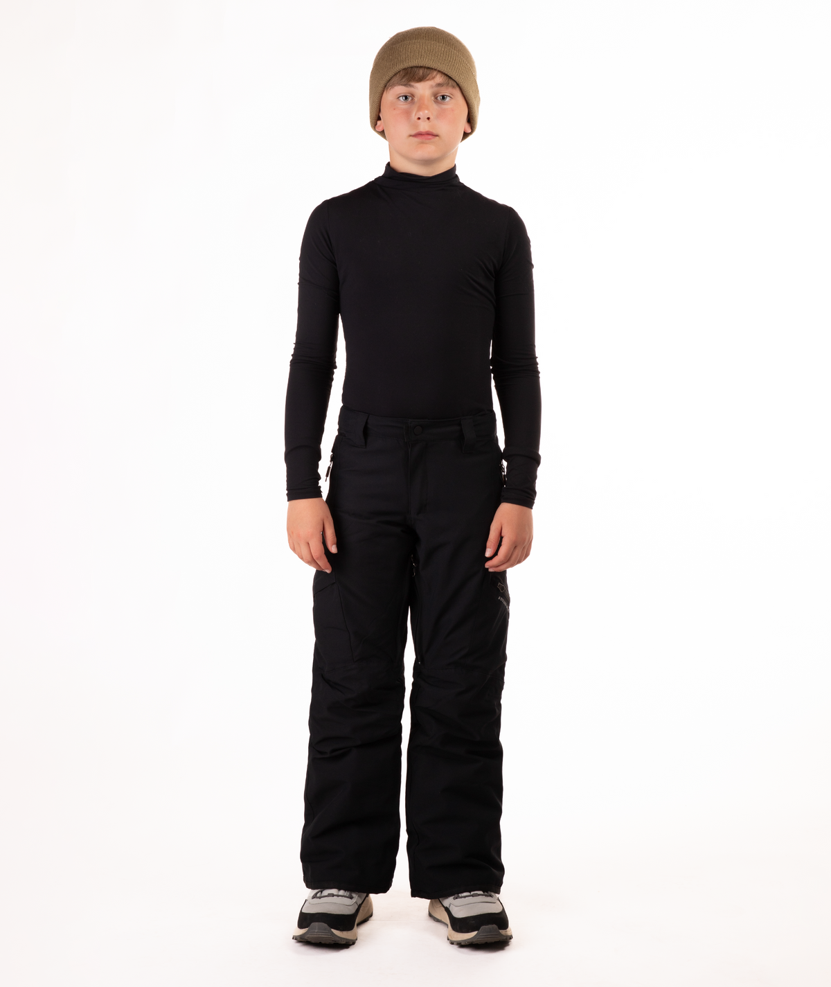 youth boy wearing a black long-sleeve shirt and black snow pants on a white background