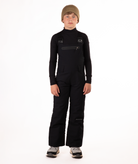 boy wearing black bibs and black top on a white background